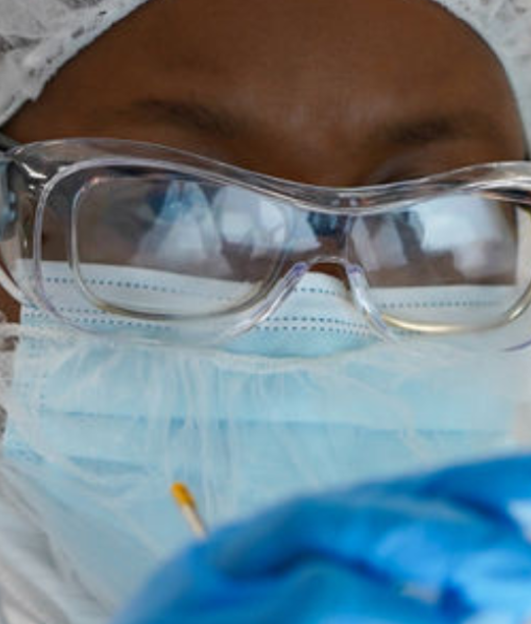 Worker in facility wearing saftery glasses