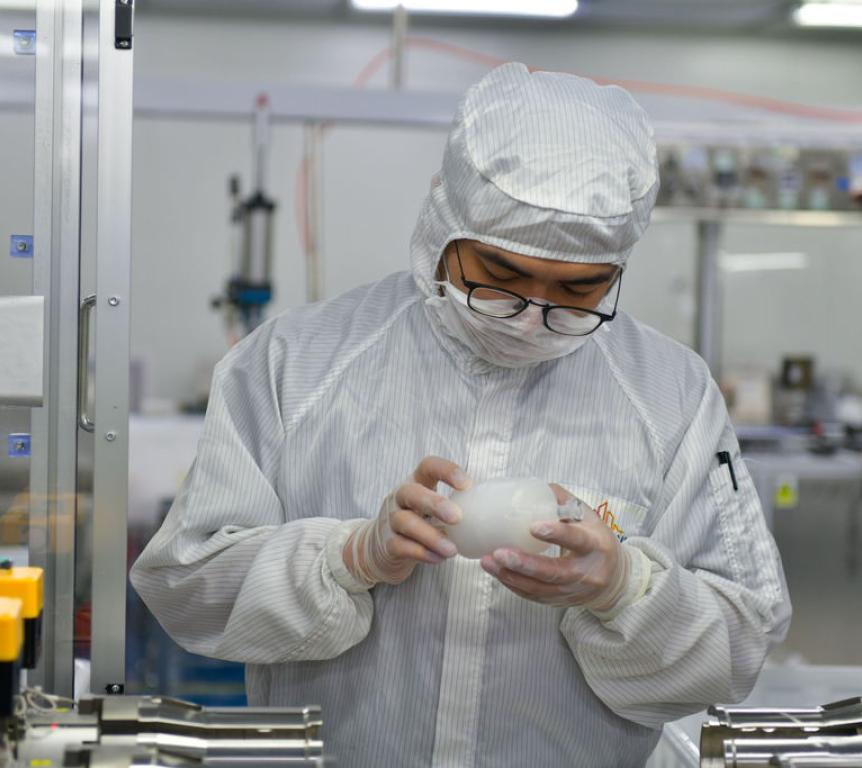 employee checking product quality