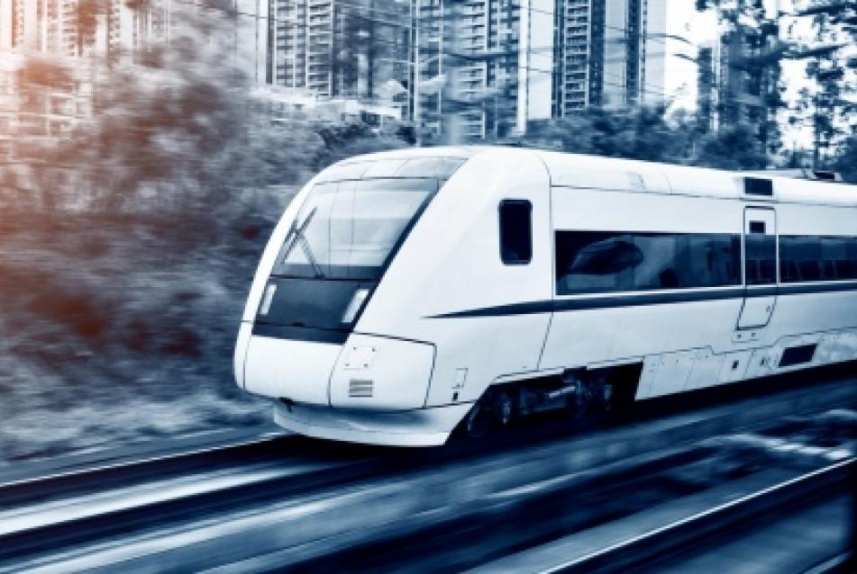 white train on tracks with blurred background