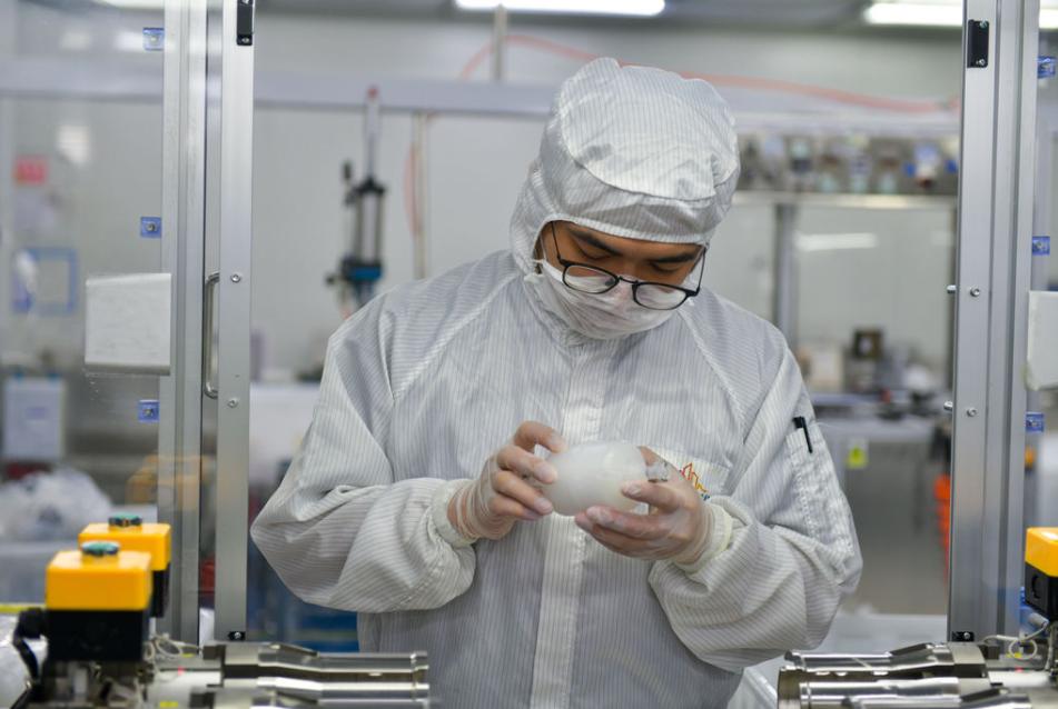 employee checking product quality